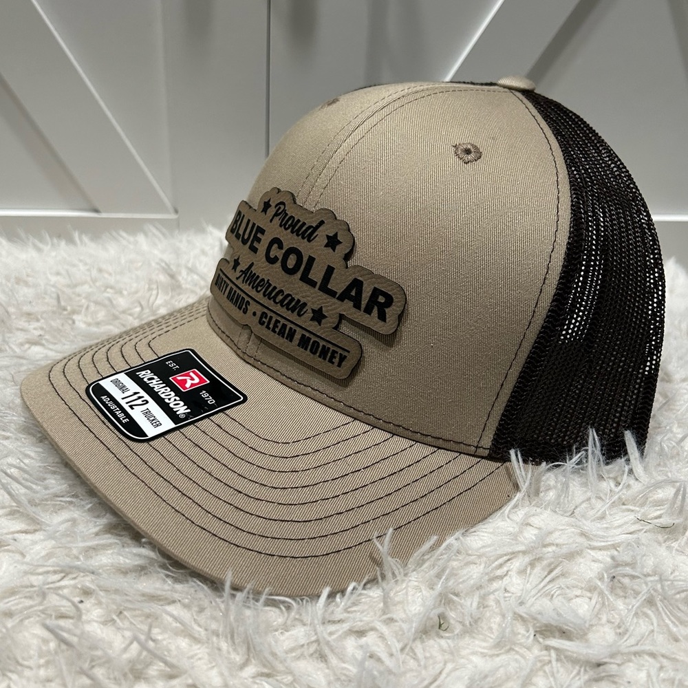 Proud blue collar American. Laser engraved Richardson 112 trucker hat.